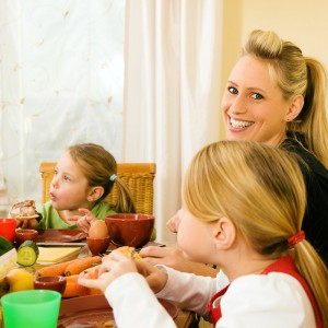 Happy Abbotsford family sitting down for dinner