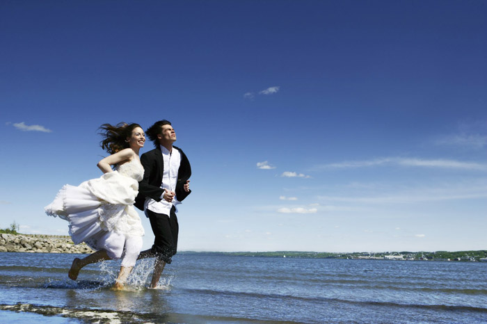 Happily married Abbotsford couple running down the beach