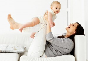 Smiling Abbotsford mom with her infant child